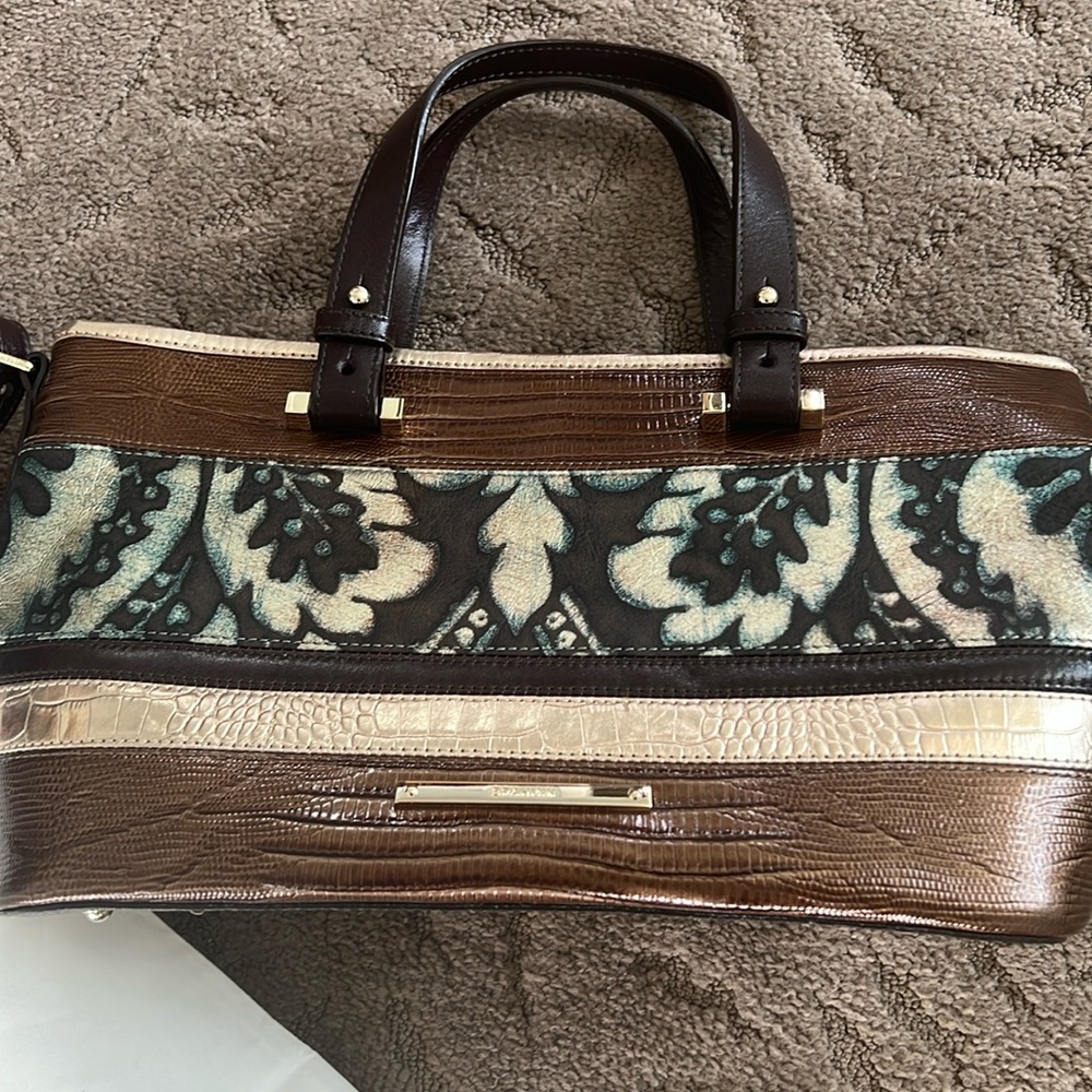New-Never used Brahmin handbag with short straps and long cross-body strap.